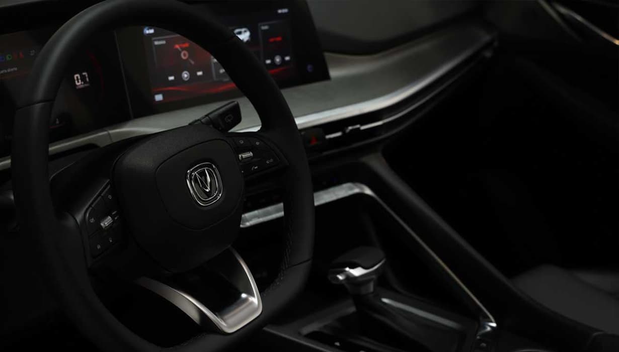 Volante multifuncion forrado en piel.